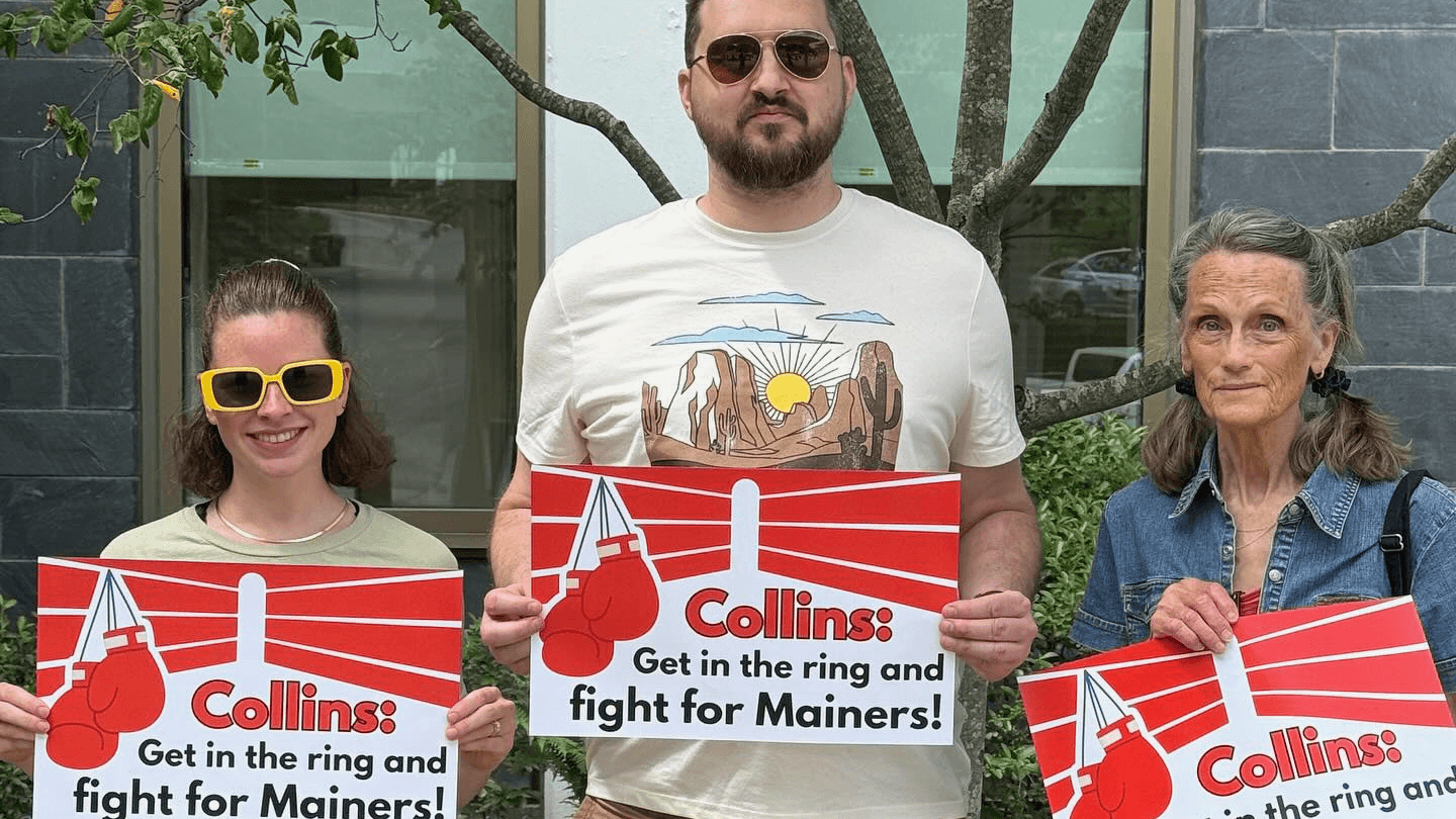 Photo: Maine People’s Resource Center pressuring Senator Susan Collins to stand up for Mainers.