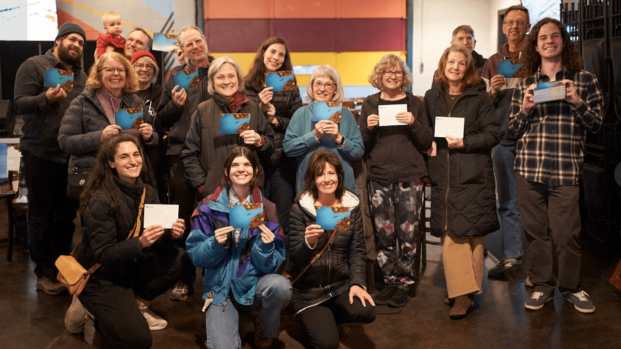 Photo: Wisconsin Conservation Voters writing postcards in support of Judge Chris Taylor for the Wisconsin Supreme Court. 