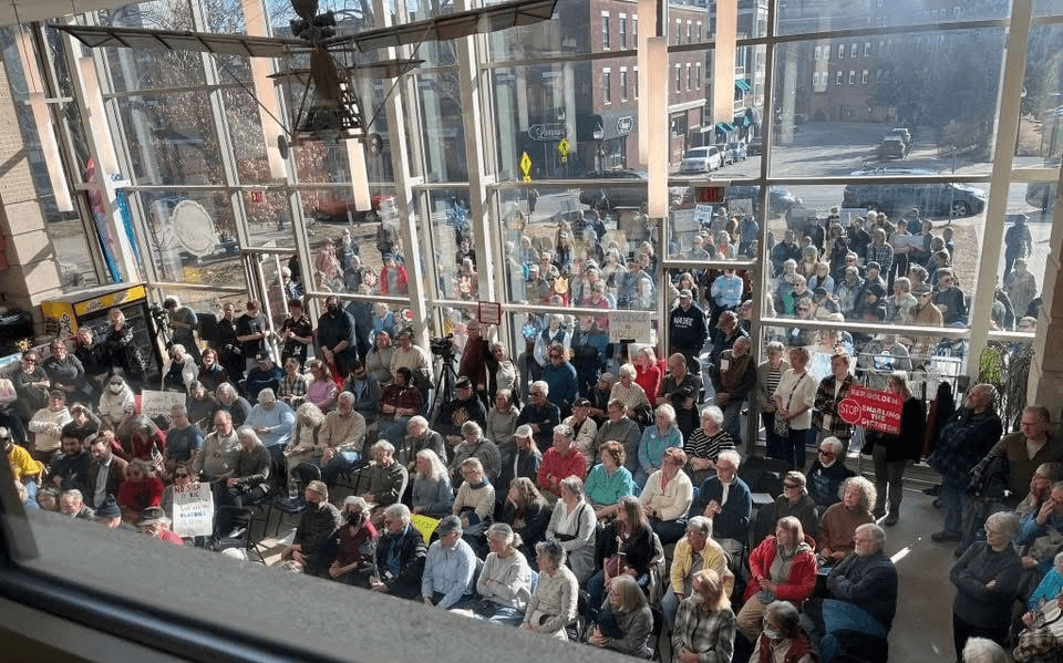 Photo: Maine People's Alliance & Food AND Medicine - Overflow attendance at a Bangor town hall (which Rep Jared Golden failed to attend)