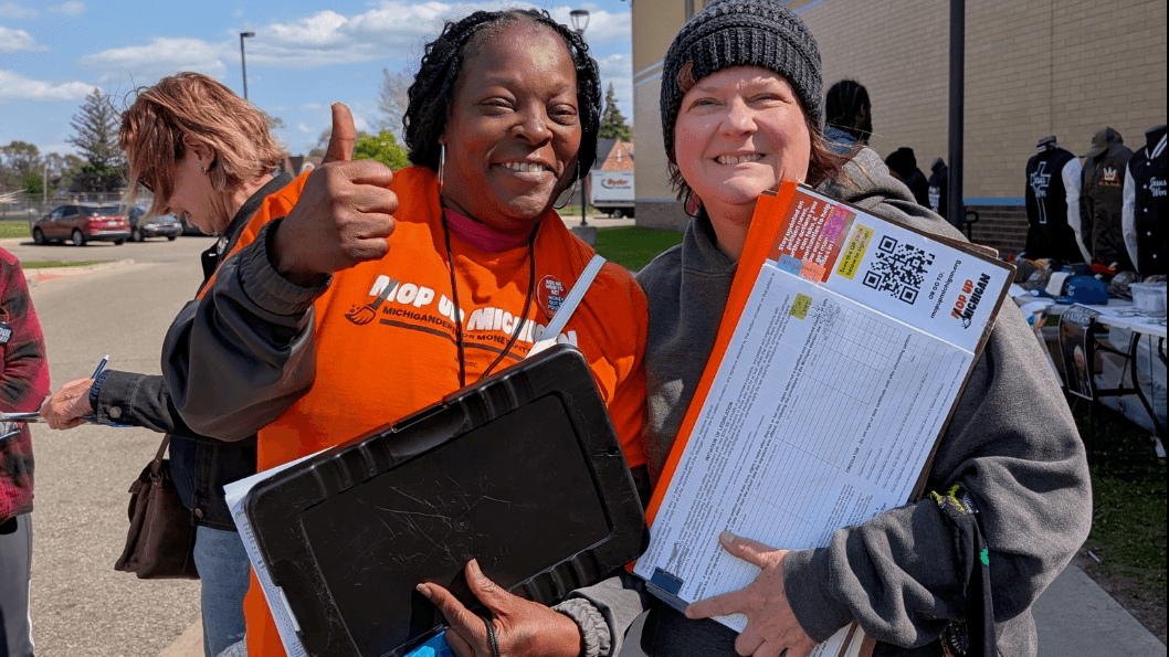 Photo: Michiganders for Money Out of Politics (MMOP) canvassers collecting signatures for a money-out-of-politics ballot measure.