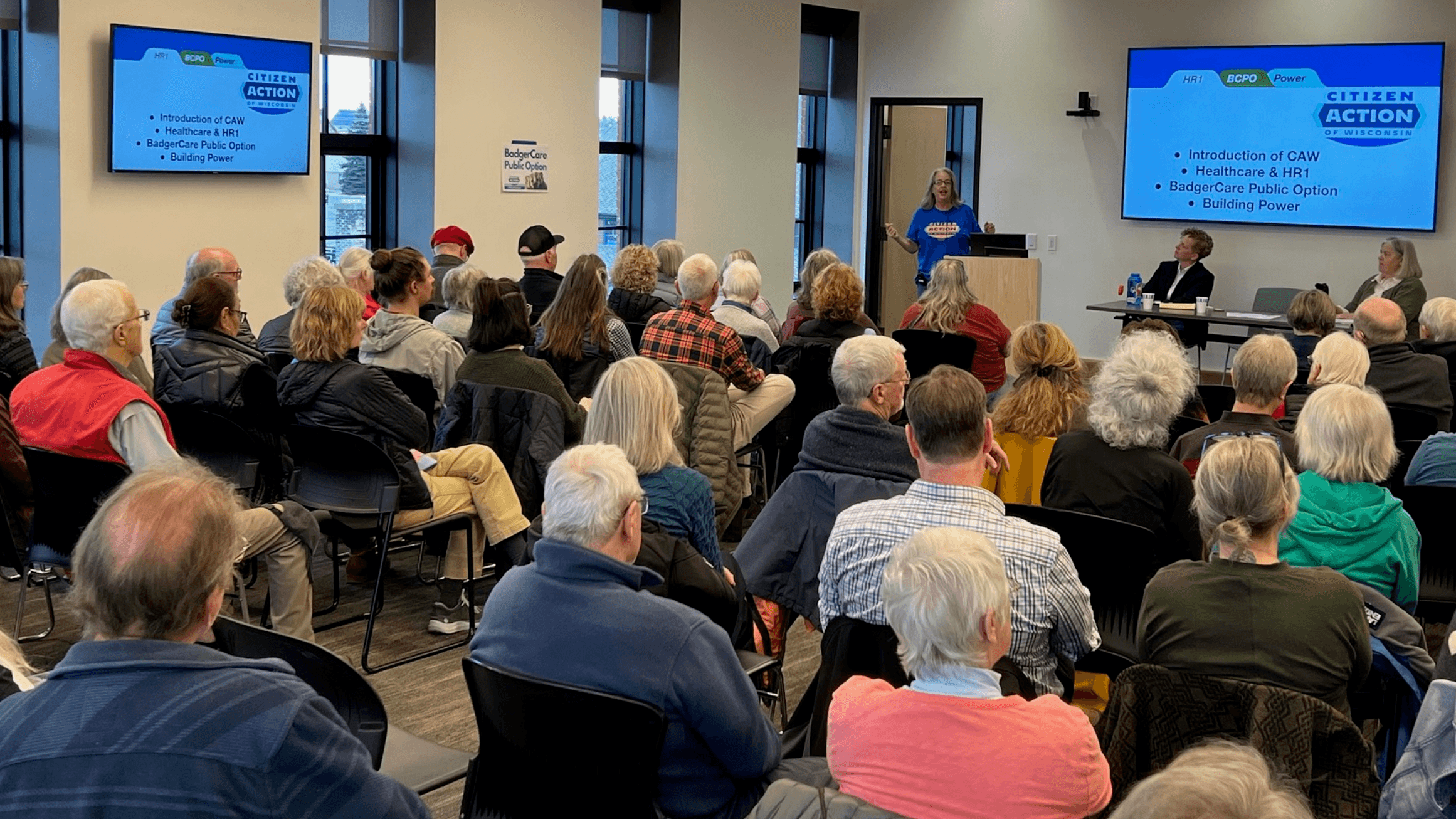 Photo: Citizen Action Wisconsin at a packed healthcare town hall with elected leaders.